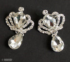 Two elegant clear crystal stone brooches displayed on a white background.