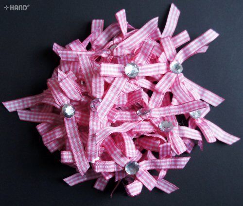 Display of multiple chequered bows in pink and white