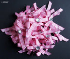 Display of multiple chequered bows in pink and white