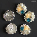 Five elegant look buttons in various colours for sewing projects