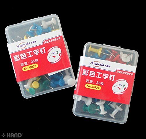 Close-up of colourful drawing board pins showcasing their vibrant hues.