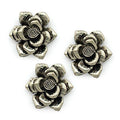 Three silver metal flower pendants for jewellery making.