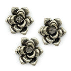 Three silver metal flower pendants for jewellery making.