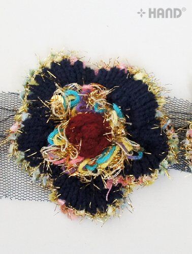 Decorative trim showcasing gold sequins and tinsel details
