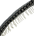 Black mesh ribbon with metal beaded fringe displayed on a roll.