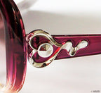 Stylish sunglasses displayed on a neutral background.