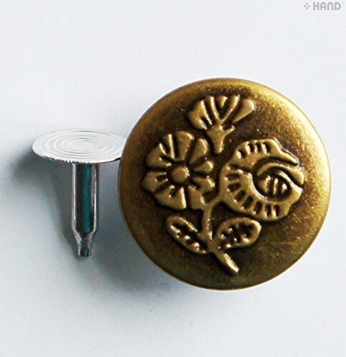 Close-up of No6 jeans buttons showing vintage gold finish