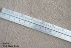 Close-up of the precisely marked double side ruler.