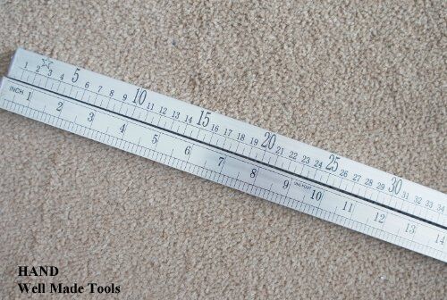 Close-up of the precisely marked double side ruler.