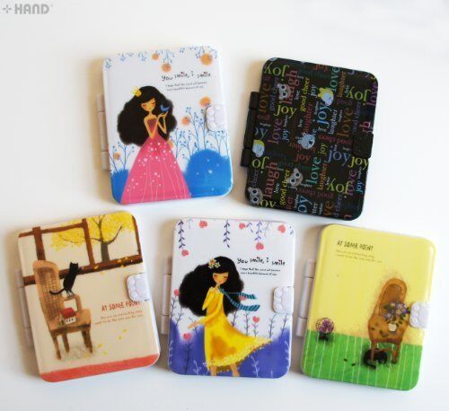 Two cute children's cartoon folding notebook mirrors with combs.
