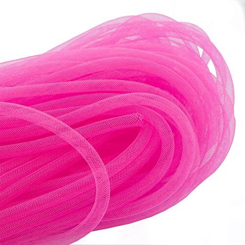 Neon pink crin trim displayed with measuring tape