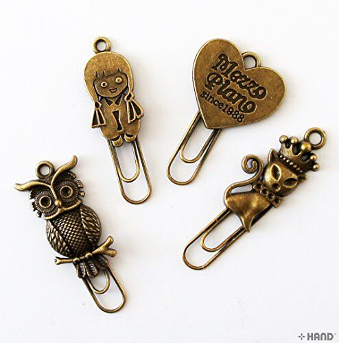 Side view of a vintage gold metal bookmark showcasing its design