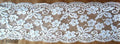White stretch lace trim, 160mm wide, displayed on a roll.