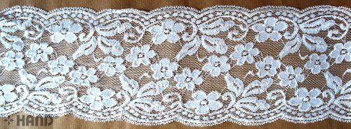 White stretch lace trim, 160mm wide, displayed on a roll.