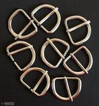 Flat lay of multiple silver tone D shape buckles