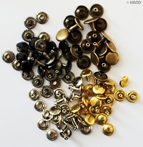 Close-up of various sizes of plain flat press studs.