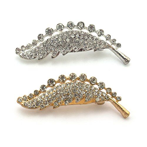 Gold and silver crystal diamante fern brooch on display