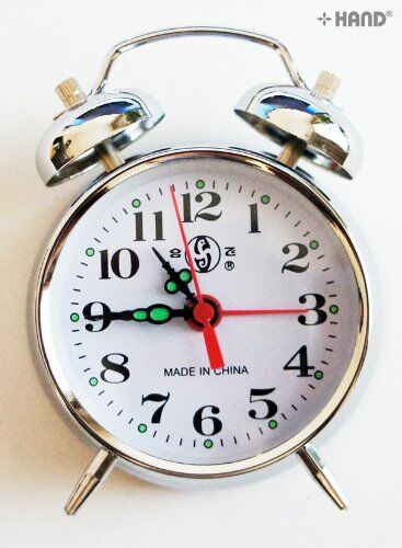 Side view of the gold alarm clock showing the dial