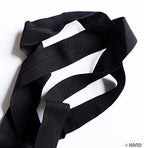 25mm wide flat elastic roll for sewing projects.