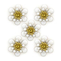 Three layers of white enamel and brass flower trim on a white background.