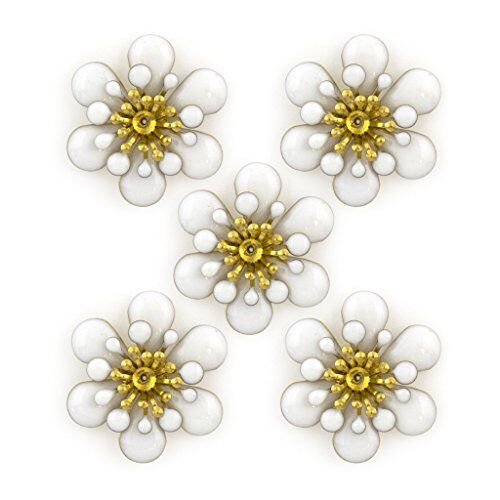 Three layers of white enamel and brass flower trim on a white background.