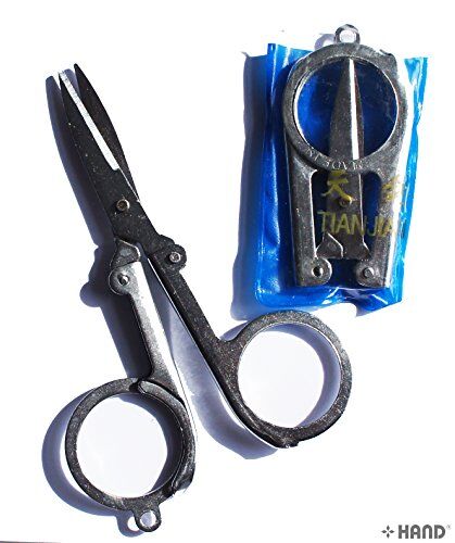 Large folding metal scissors displayed on a white background