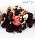 Roll of 1 metre soft knitted flower net trim displayed on a flat surface