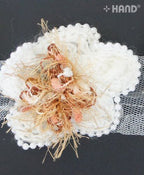 Close-up of colourful centre of the knitted flower trim