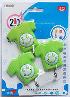 Close-up of a red self-adhesive hook for kids' use
