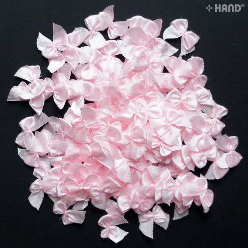 Various angles of pink ribbon bows in the pack