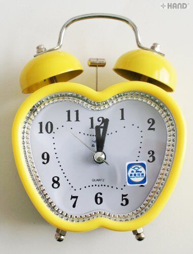 Apple-shaped alarm clock with twin metal bells