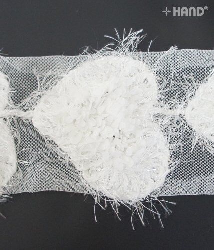 Close-up of the flower petals on the angel heart net trim