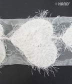 Close-up of the flower petals on the angel heart net trim