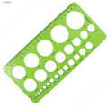 Plastic educational drawing template showing various circle sizes.