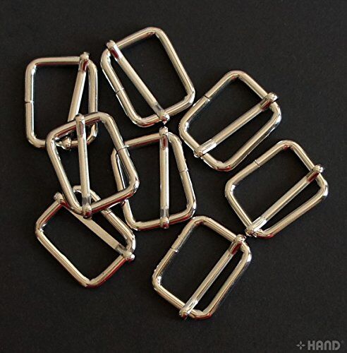 Silver tone metal sliders displayed in a neat arrangement.