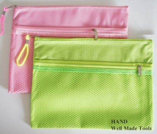 Close-up of a durable fabric tool bag with zipper, measuring 28x21cm.