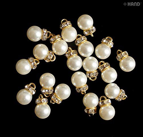 Close-up of dangle imitation pearls beads with rhinestones