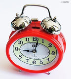 Close-up of the metal twin bell mechanism of the alarm clock