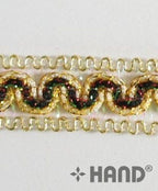 Close-up of the decorative gold trim ribbon's intricate design.