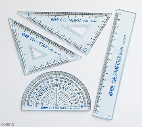 Set of 4 small plastic rulers displayed in a case
