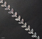 LEAF3 silver leaves trim displayed with other craft supplies.