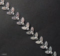 Close-up of LEAF3 silver leaves trim showcasing intricate details.