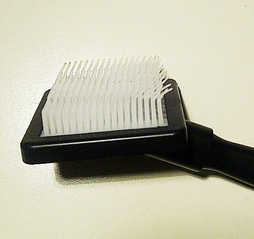 Close-up of the plastic brush showing bristle detail