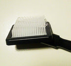 Close-up of the plastic brush showing bristle detail