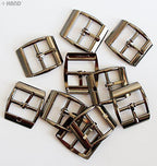 Five pairs of gunmetal tone buckles displayed together