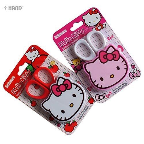 Hello Kitty plastic scissors with a fancy cover, 9cm long.