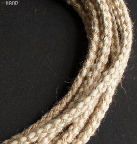 Cream and brown plait string rope cord displayed on a white background.