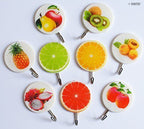 Close-up of a self-adhesive hook holding kitchen fruit.