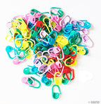 Close-up of plastic locking stitch holders for knitting