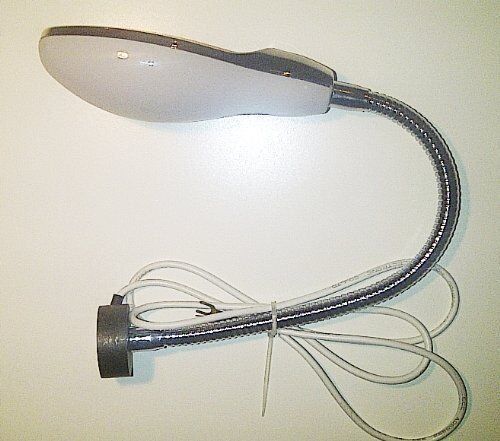 Sewing machine with the gooseneck lamp attached